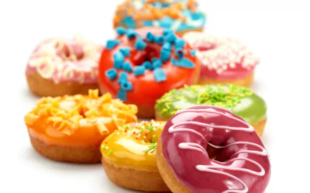 HD desktop wallpaper featuring a close-up of colorful, decorated doughnuts arranged in a visually appealing composition.