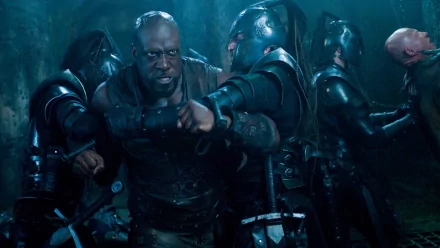 HD PC desktop wallpaper featuring an intense fight scene from the movie Underworld: Evolution, showcasing armored characters in a dark, dramatic setting.