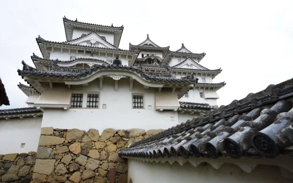 HD PC desktop wallpaper featuring the man-made architecture of Himeji Castle with its white walls and traditional tiled roofs.
