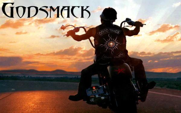 HD PC desktop wallpaper featuring a silhouette of a motorcyclist at sunset with the Godsmack band logo, blending music and a rugged, adventurous vibe.