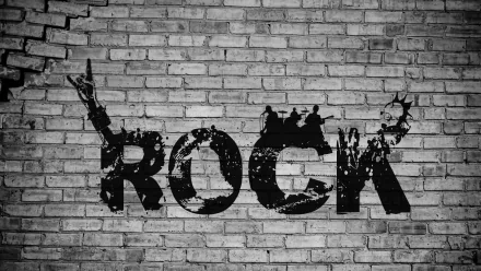 A high-definition desktop wallpaper featuring the bold word ROCK in a gritty, graffiti style against a textured brick background, capturing the essence of rock music.