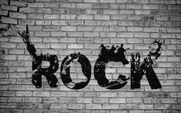 A high-definition desktop wallpaper featuring the bold word ROCK in a gritty, graffiti style against a textured brick background, capturing the essence of rock music.