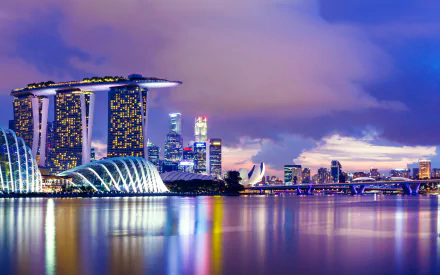 HD desktop wallpaper showcasing the iconic Marina Bay Sands and Singapore skyline at dusk with vibrant reflections on the water.