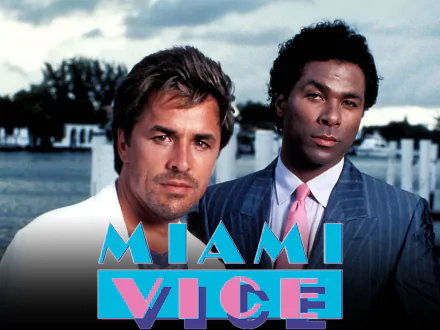 HD desktop wallpaper featuring the main characters from the TV show Miami Vice against a waterfront backdrop.