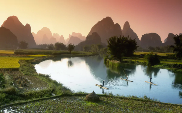 Serene landscape of the Nanling Mountains, with the Li River winding through lush greenery and karst peaks in Guangxi Zhuang, showcasing the beauty of China's nature.