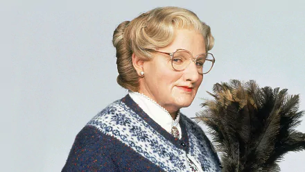 HD wallpaper of Mrs. Doubtfire character holding a feather duster against a plain background.