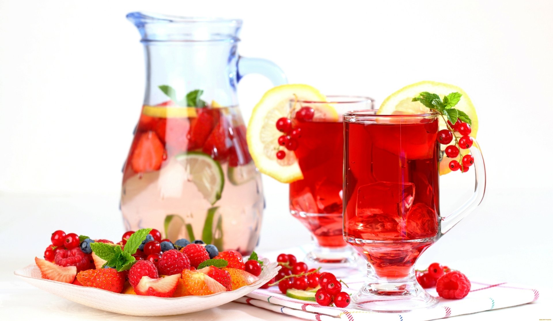 A vibrant 4K Ultra HD desktop wallpaper featuring refreshing red berry drinks with lemon slices and a plate of mixed fresh berries, showcasing colorful food and drink.