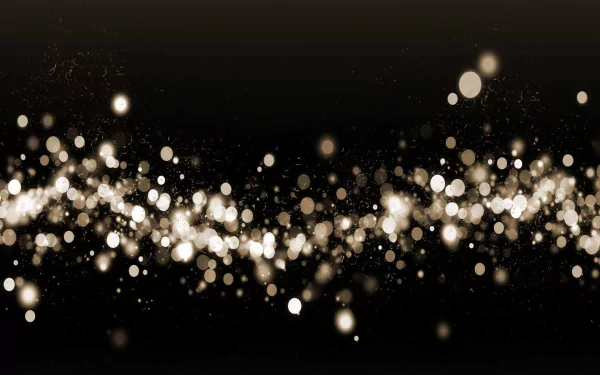 Artistic bokeh effect with glowing golden light orbs scattered across a dark background, designed as an HD PC desktop wallpaper and background.