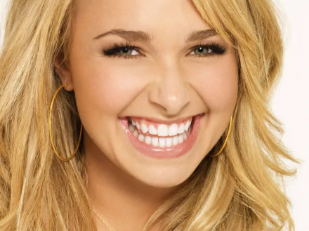 Close-up smiling blonde woman with hoop earrings and bright smile — 4K Ultra HD PC desktop wallpaper/background.