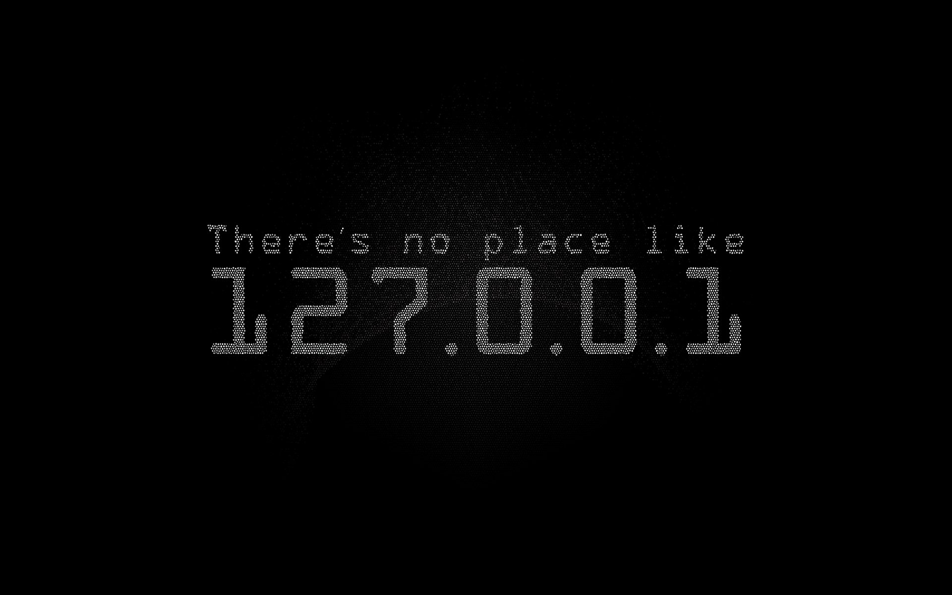 A humorous HD desktop wallpaper featuring the phrase There's no place like 127.0.0.1 against a dark background, celebrating the concept of localhost in a playful way.