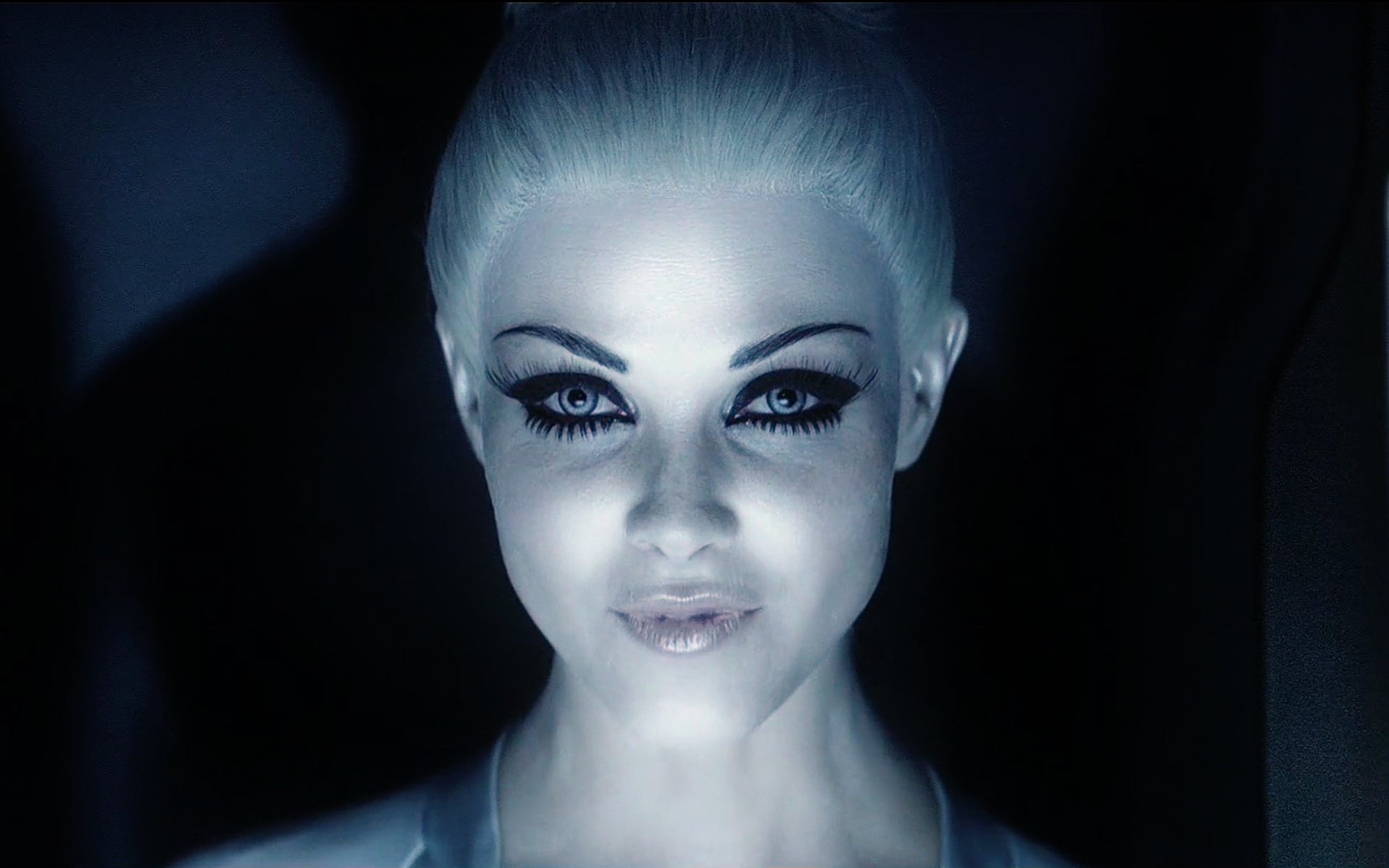 HD PC desktop wallpaper: close-up of a pale, illuminated female program from the movie TRON: Legacy, with futuristic glowing makeup and icy blue lighting.