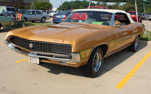 Gold Ford Torino convertible in a parking lot, rendered as a 4K Ultra HD PC desktop wallpaper/background.