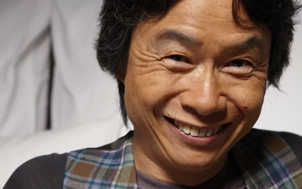 HD desktop wallpaper featuring a smiling man in a plaid shirt, suitable as a background image.