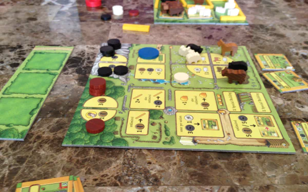 HD desktop wallpaper featuring the board game Agricola mid-play with colorful game pieces and cards on a tabletop.