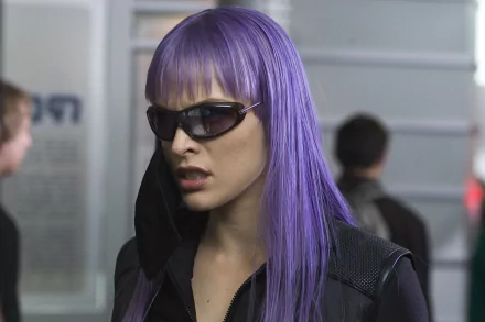 HD desktop wallpaper featuring Milla Jovovich as her character from the movie Ultraviolet, wearing purple hair and dark sunglasses in a futuristic setting.