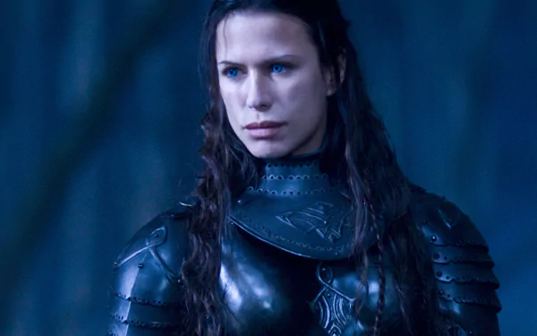 HD PC desktop wallpaper featuring a close-up of a character from the movie Underworld: Rise of the Lycans in dark armor with intense blue lighting.