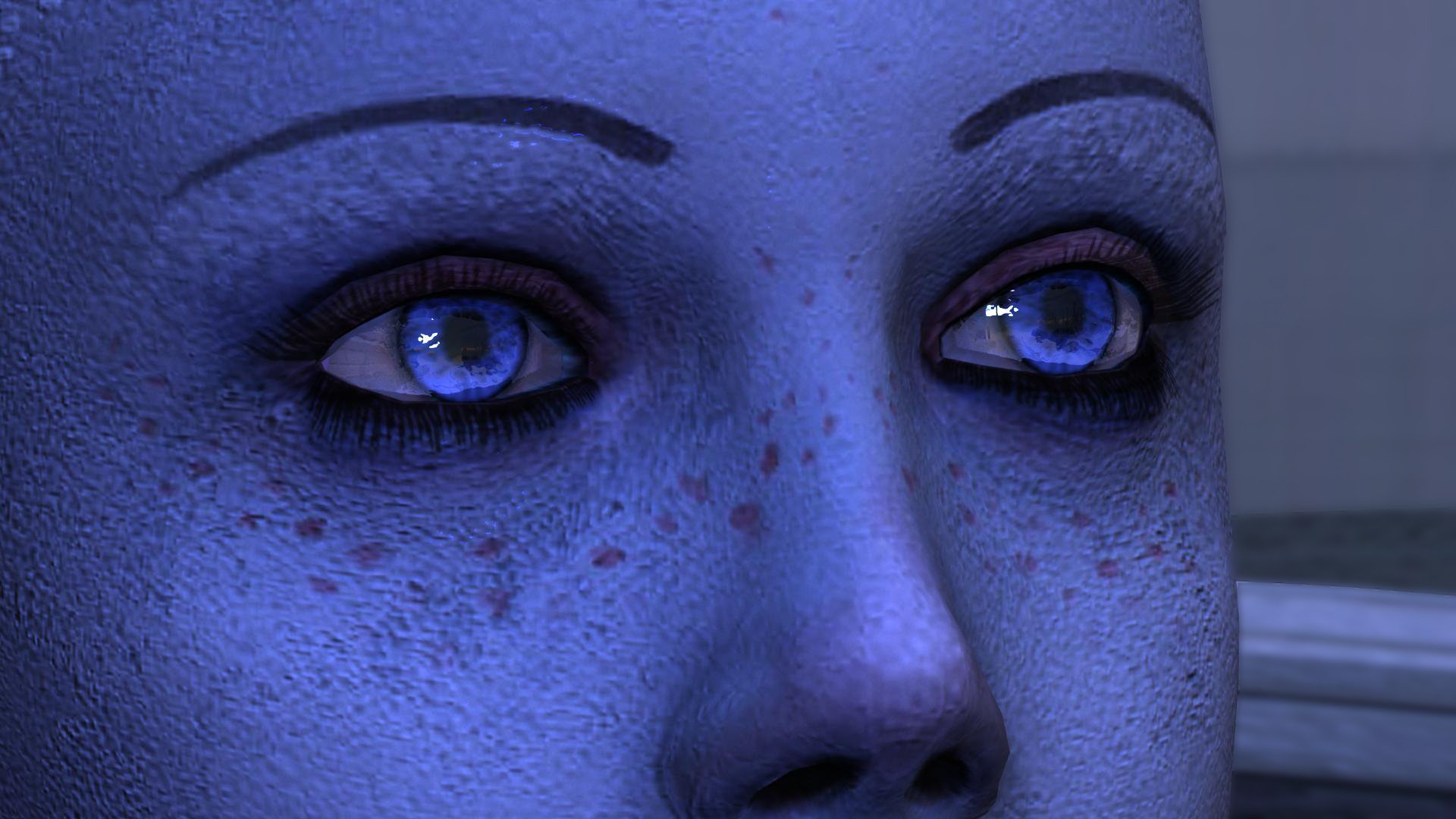 Close-up HD PC desktop wallpaper of Liara T'Soni, the blue-skinned character from the Mass Effect video game series, highlighting her detailed eyes and facial features.