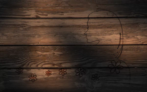 Artistic HD desktop wallpaper featuring a subtle outline of a face and flowers carved into textured wooden planks.
