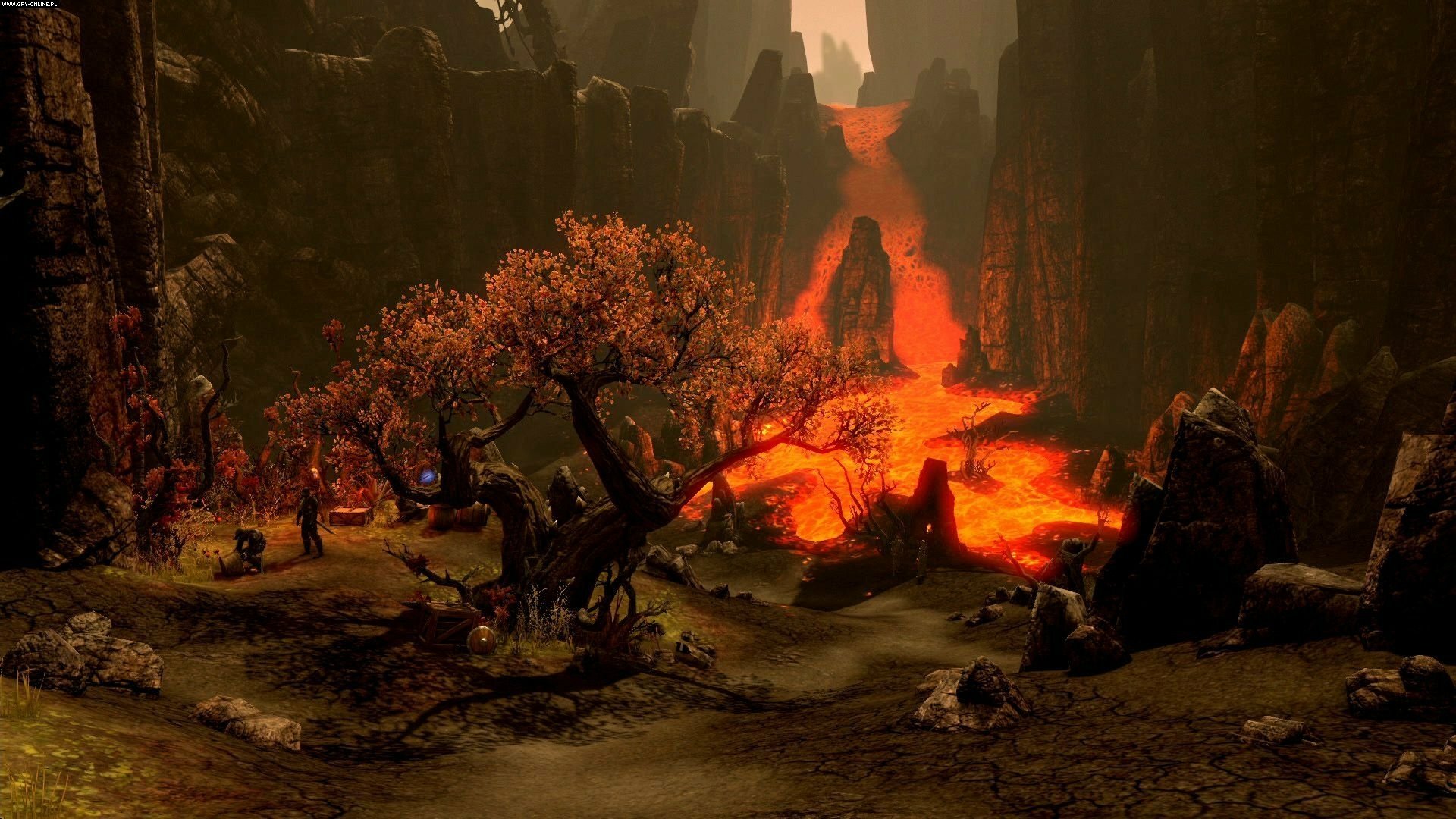 HD PC desktop wallpaper from The Elder Scrolls Online featuring a volcanic landscape with flowing lava and autumnal trees in a dramatic, fiery environment.