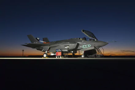 Lockheed Martin F-35 Lightning II military jet parked on runway at dusk, featured in a high-definition PC desktop wallpaper and background.