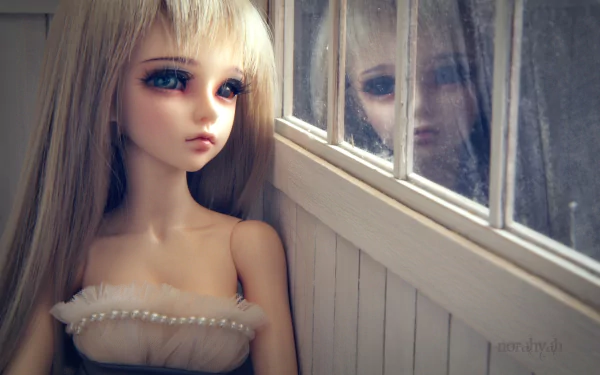 HD PC desktop wallpaper of a man-made doll with long blonde hair gazing thoughtfully by a window, her reflection softly visible on the glass.