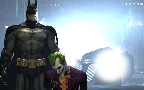 Batman stands next to the Joker in a dark, atmospheric scene from the video game Batman: Arkham Asylum, captured in 4K Ultra HD for PC desktop wallpaper.