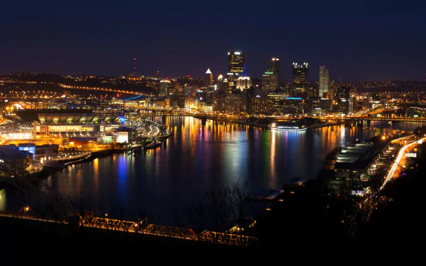 4K Ultra HD PC desktop wallpaper and background: nighttime man-made Pittsburgh skyline with illuminated bridges and colorful reflections on the river.