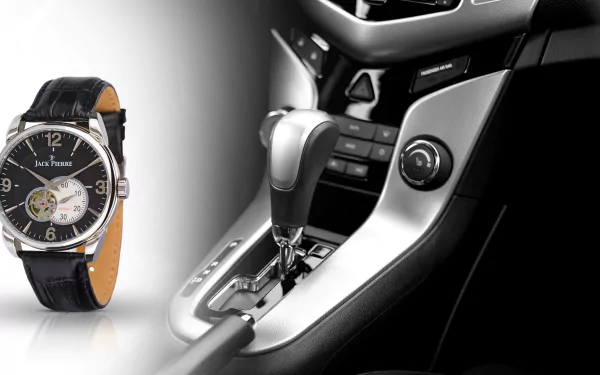 HD desktop wallpaper featuring a Jack Pierre man-made watch alongside a close-up of a modern car's gear shift and control panel.