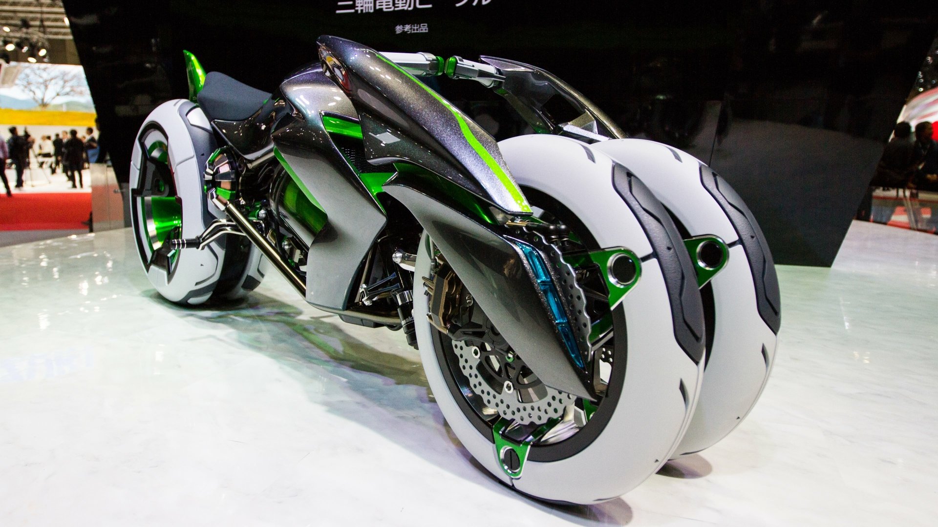 A sleek Kawasaki Electric J motorcycle with an innovative design featuring unique white wheels, showcased as a vibrant 4K Ultra HD PC desktop wallpaper.