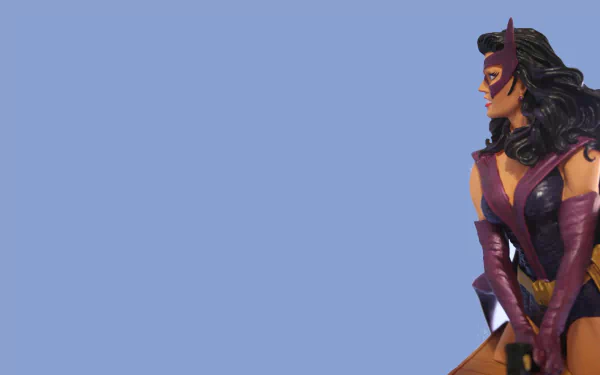 HD PC desktop wallpaper featuring Huntress from DC Comics, depicted as a skilled hunter against a minimalist blue background.