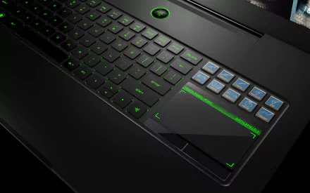 A close-up of a sleek laptop keyboard featuring a modern design with green backlighting, showcasing the intersection of technology and user experience in a high-definition wallpaper.