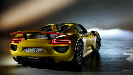 A dynamic Porsche 918 Spyder in striking yellow, showcased in an HD desktop wallpaper, highlighting its sleek design and powerful presence.