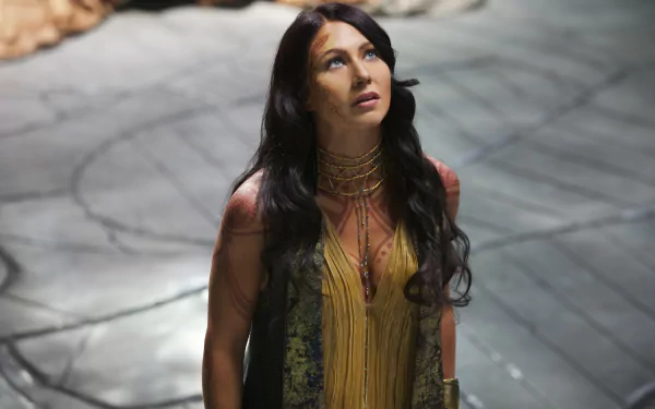 4K Ultra HD wallpaper featuring Lynn Collins as brunette Dejah Thoris from the movie John Carter, set against a dramatic textured background.