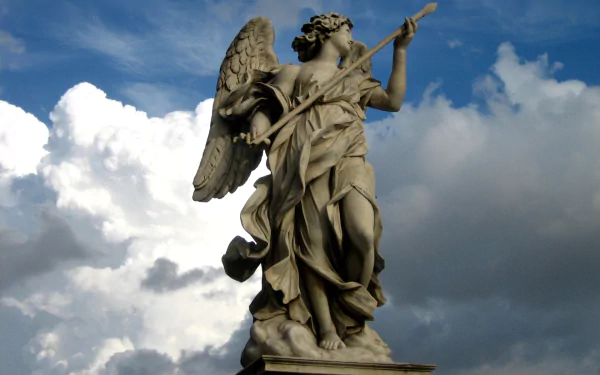 HD desktop wallpaper featuring a detailed man-made angel statue against a dramatic cloudy sky background.
