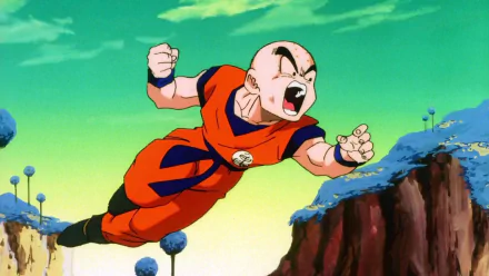 HD desktop wallpaper from Dragon Ball Z featuring Krillin in action above a rugged landscape.