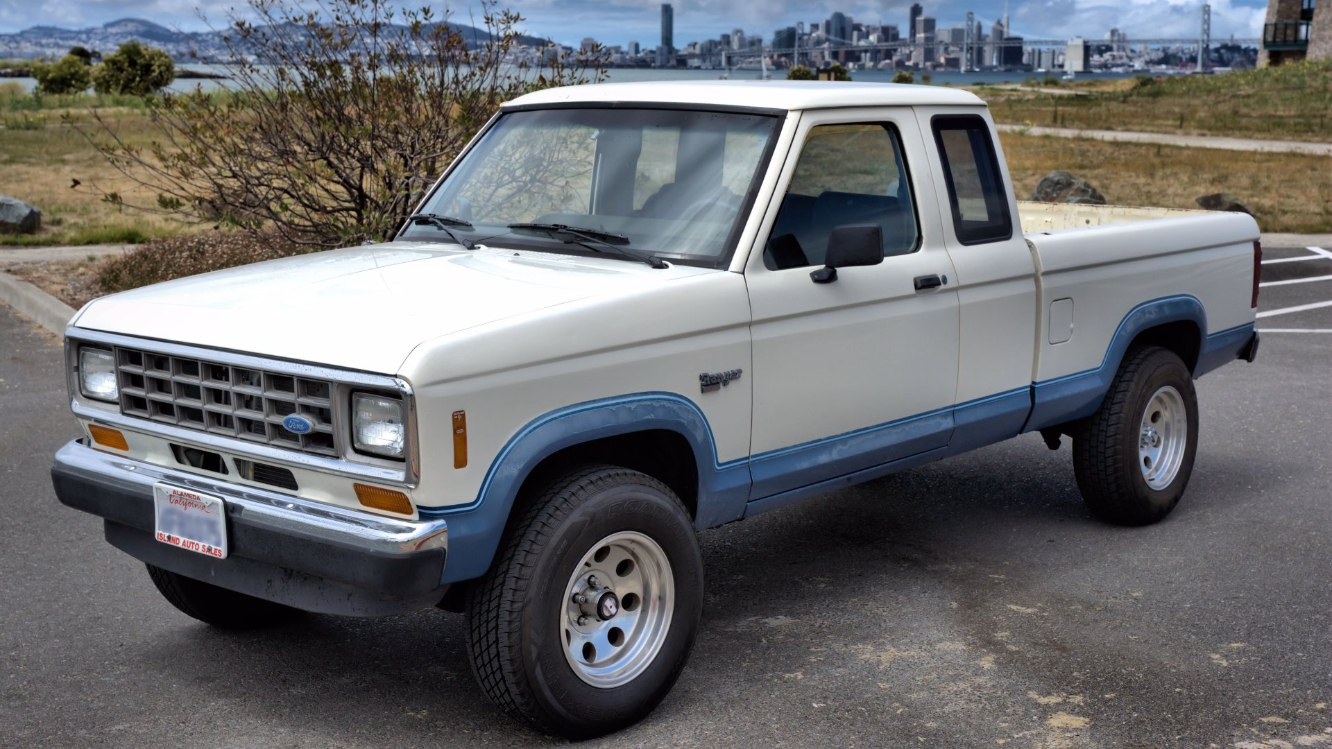 A Ford Ranger parked in a scenic outdoor setting, showcasing its classic design. This 4K Ultra HD image serves as a striking PC desktop wallpaper and background.