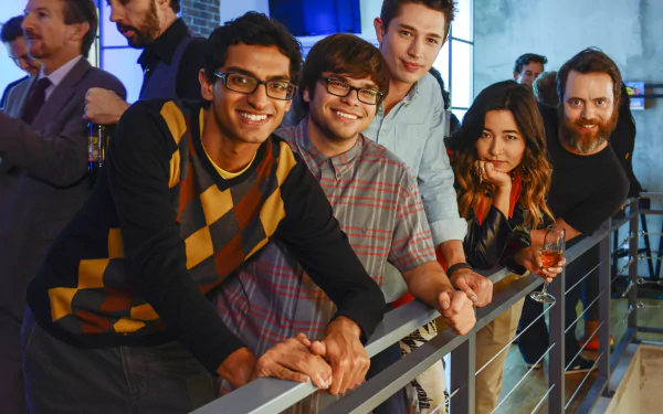 HD desktop wallpaper featuring a group of people smiling and leaning on a railing, associated with 'Betas'.