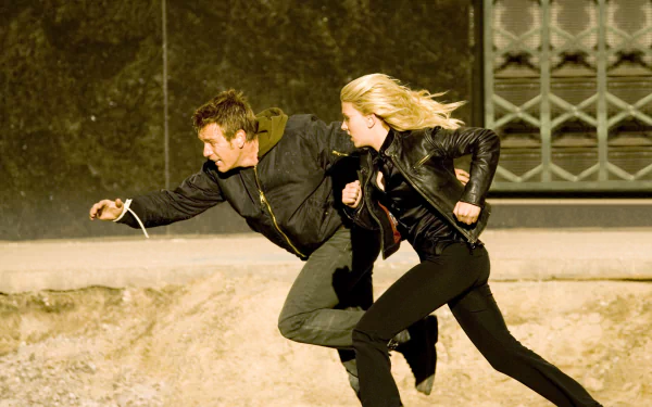HD desktop wallpaper featuring Scarlett Johansson and Ewan McGregor in an action scene from the movie The Island.