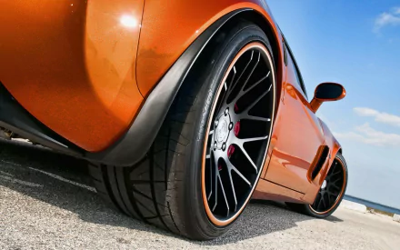 Close-up view of an orange Lexus GS 350 with customized black and orange rims, captured in HD quality for a PC desktop wallpaper and background.