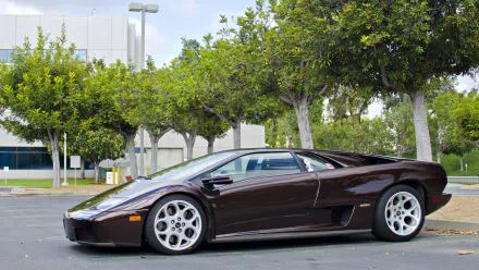 A sleek Lamborghini Diablo parked in an outdoor setting, showcased in crisp 4K Ultra HD as a striking PC desktop wallpaper background.