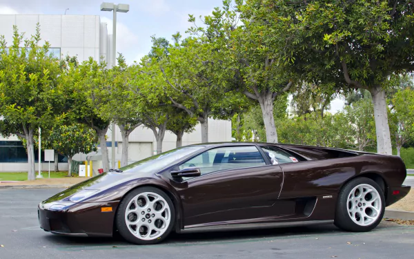 A sleek Lamborghini Diablo parked in an outdoor setting, showcased in crisp 4K Ultra HD as a striking PC desktop wallpaper background.