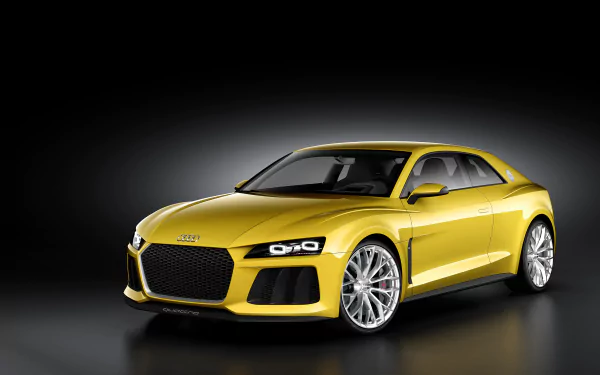 Yellow Audi Sport Quattro sports car on a dark gradient backdrop, 2K Quad HD PC desktop wallpaper/background.