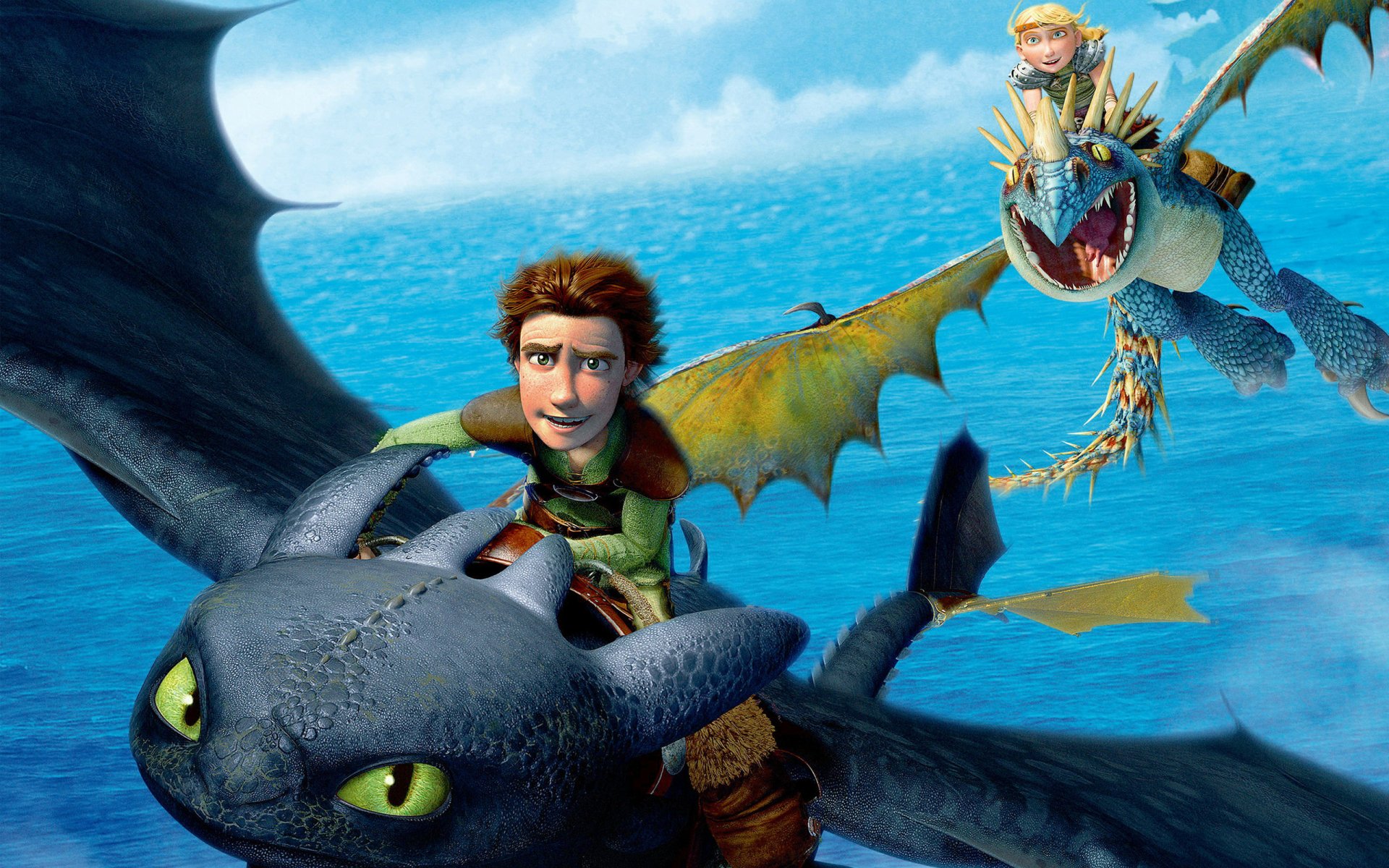 Hiccup rides Toothless alongside Astrid in this vibrant HD wallpaper from *How to Train Your Dragon*, capturing their adventurous spirit against a stunning ocean backdrop.
