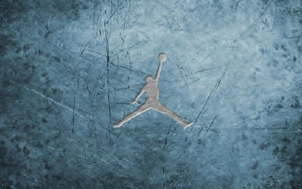 HD desktop wallpaper featuring a textured blue background with the Jordan Logo of a basketball player in mid-jump.