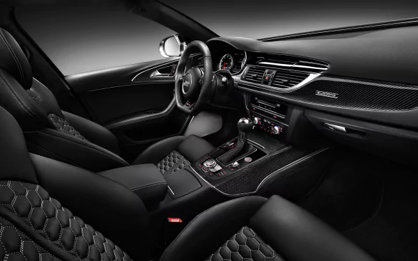 HD PC desktop wallpaper showcasing the sleek, luxurious interior of an Audi RS6 vehicle with detailed carbon fiber and leather finishes.