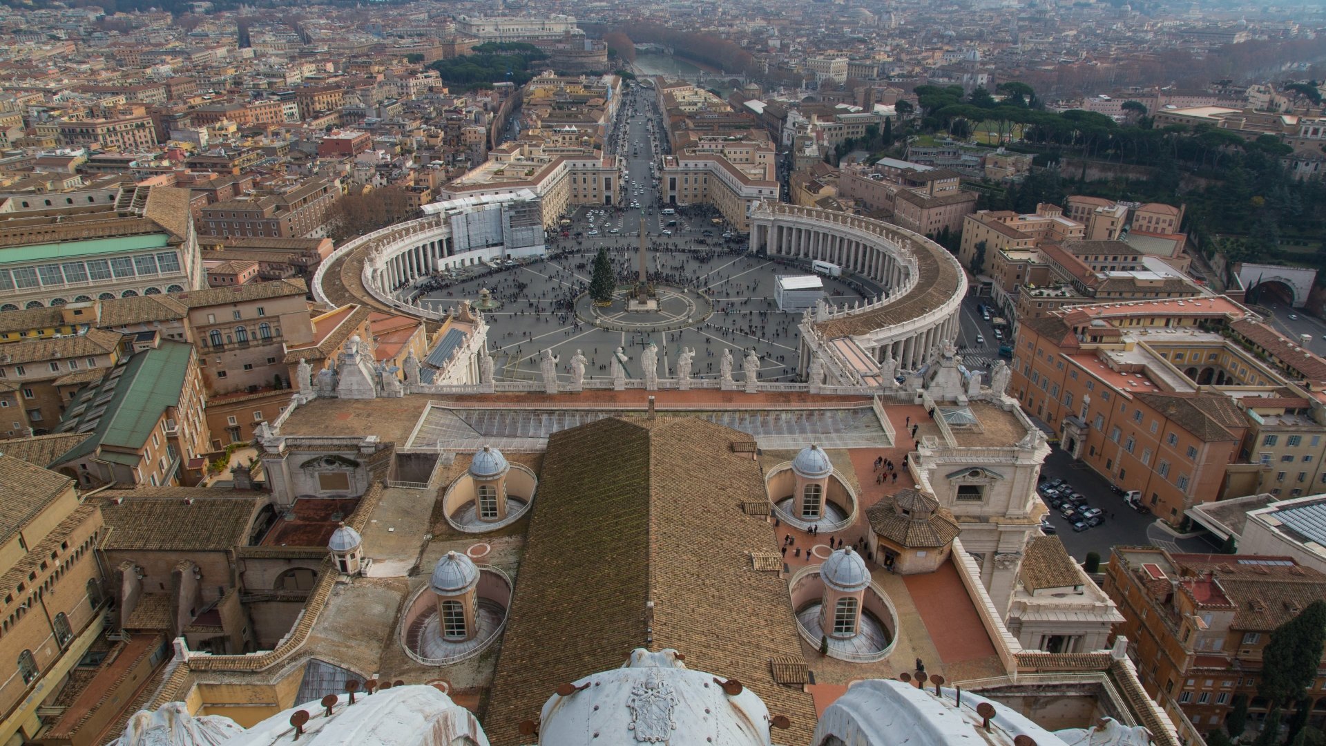 A stunning aerial view of St. Peter's Round Square, showcasing its elegant architecture and the surrounding cityscape. This image makes an impressive 4K Ultra HD desktop wallpaper.