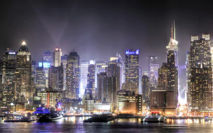 Nighttime HD desktop wallpaper showcasing the illuminated Manhattan skyline, highlighting iconic man-made structures across New York and New Jersey waterfronts.