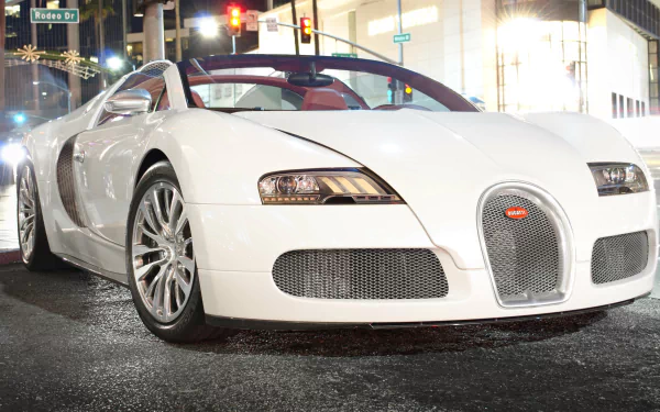 White Bugatti Veyron parked on a city street at night, captured in 4K Ultra HD for a PC desktop wallpaper and background.