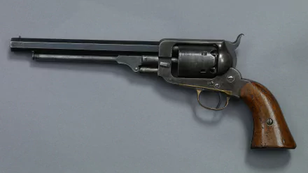 A high-definition image of a vintage revolver, showcasing its intricate details and craftsmanship, designed as a desktop wallpaper and background.