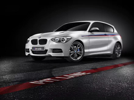 Silver 2012 BMW Concept M135i hatchback with M-stripe accents, studio-lit on asphalt — HD PC desktop wallpaper background.